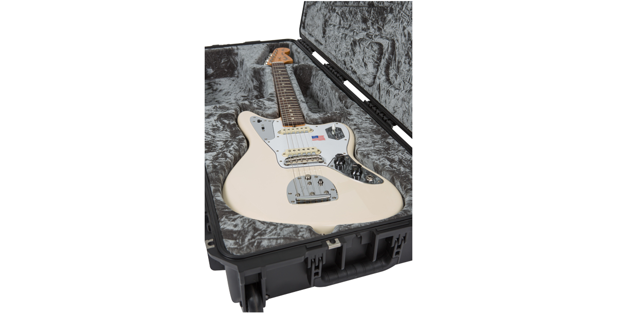 Jaguar Jazzmaster white electric guitar snugly fitted in SKB iSeries Waterproof Case with plush grey lining and reinforced shell.