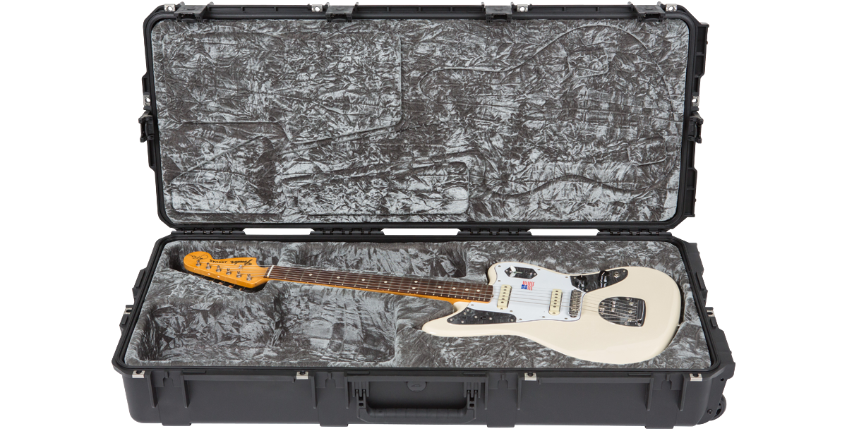 White Jaguar electric guitar inside waterproof SKB iSeries case, designed with TSA locks and contoured foam for maximum protection.