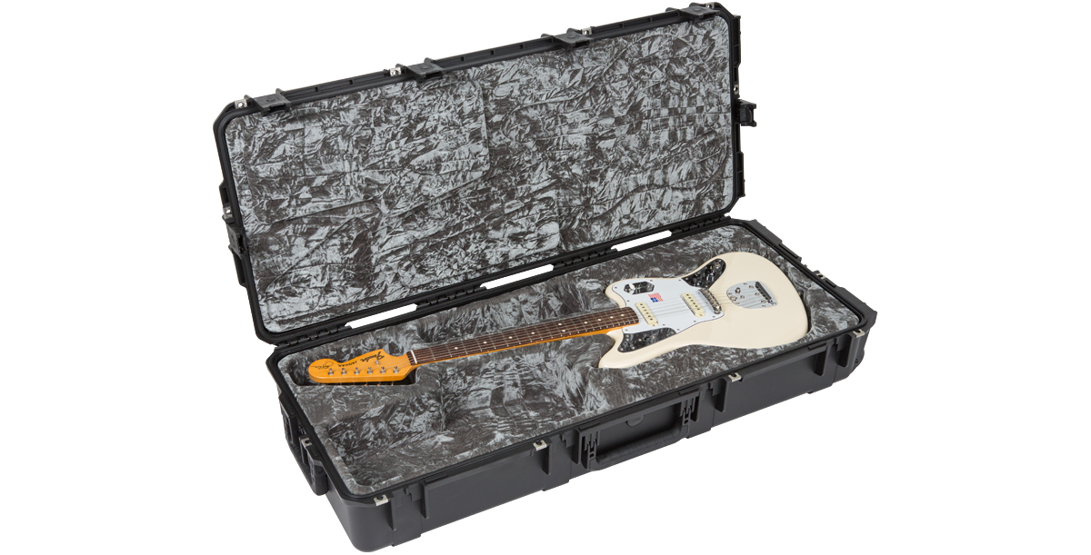 SKB waterproof guitar case with white Jaguar guitar, designed for durability with TSA locks and contoured interior for protection.