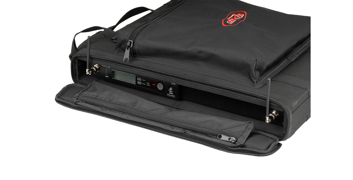 Open 1U Soft Rack Series case showing installed wireless system, zippered compartments, and padded interior for secure transport.