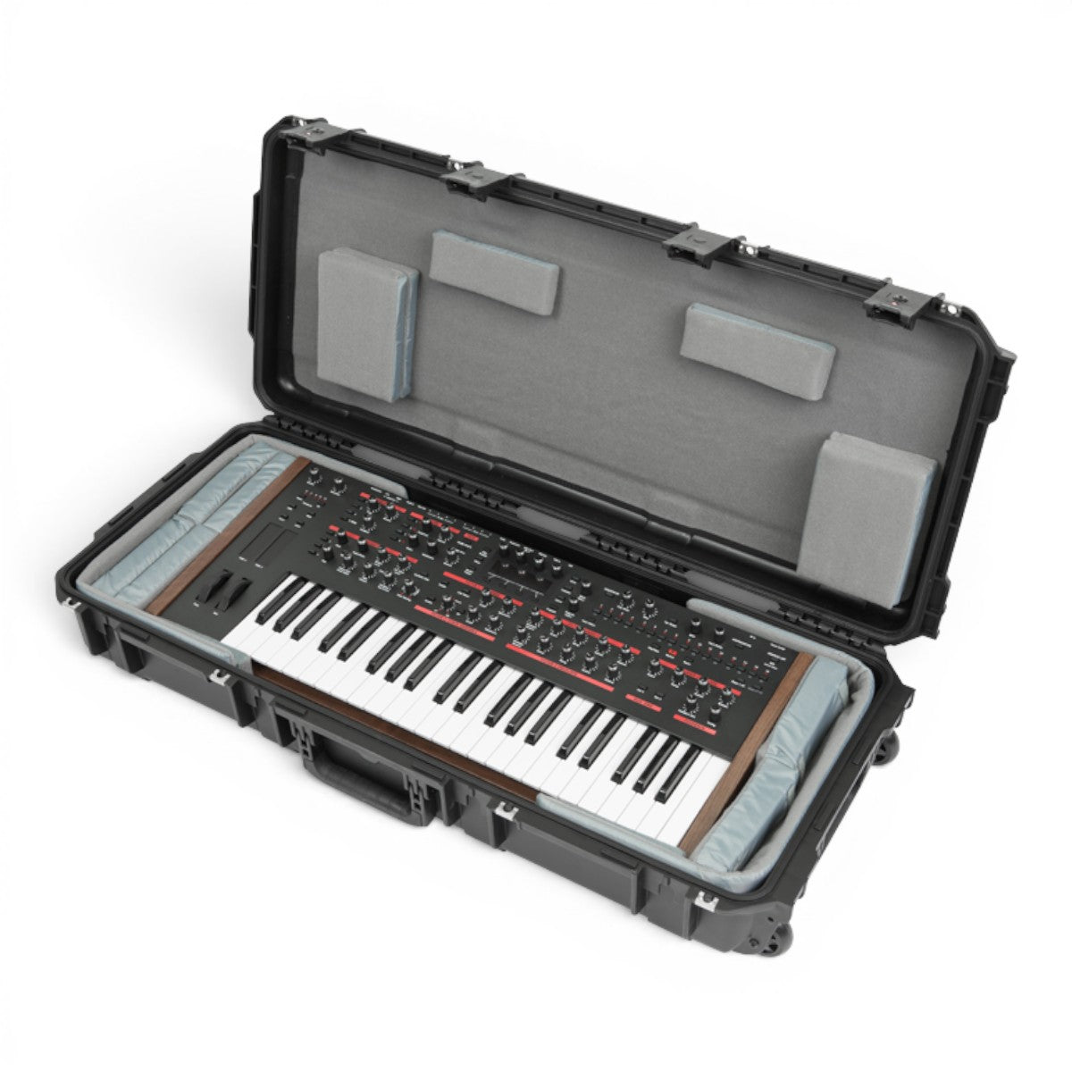 SKB Cases iSeries 49-note keyboard case with customizable grey foam interior and a synthesizer inside