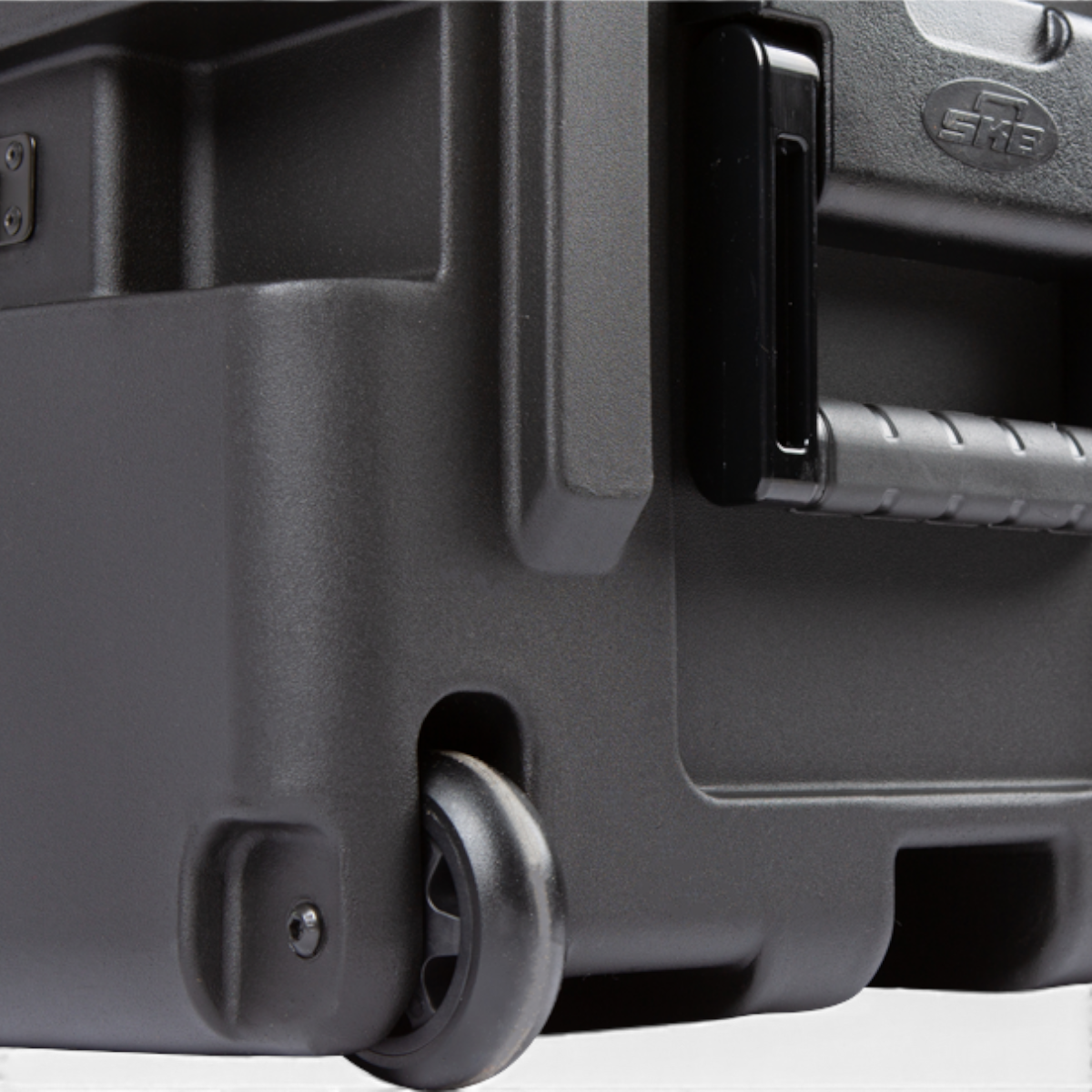 Close-up of the black SKB Cases 7U shock rack showing the durable roto-molded shell, spring-loaded handle, and caster.