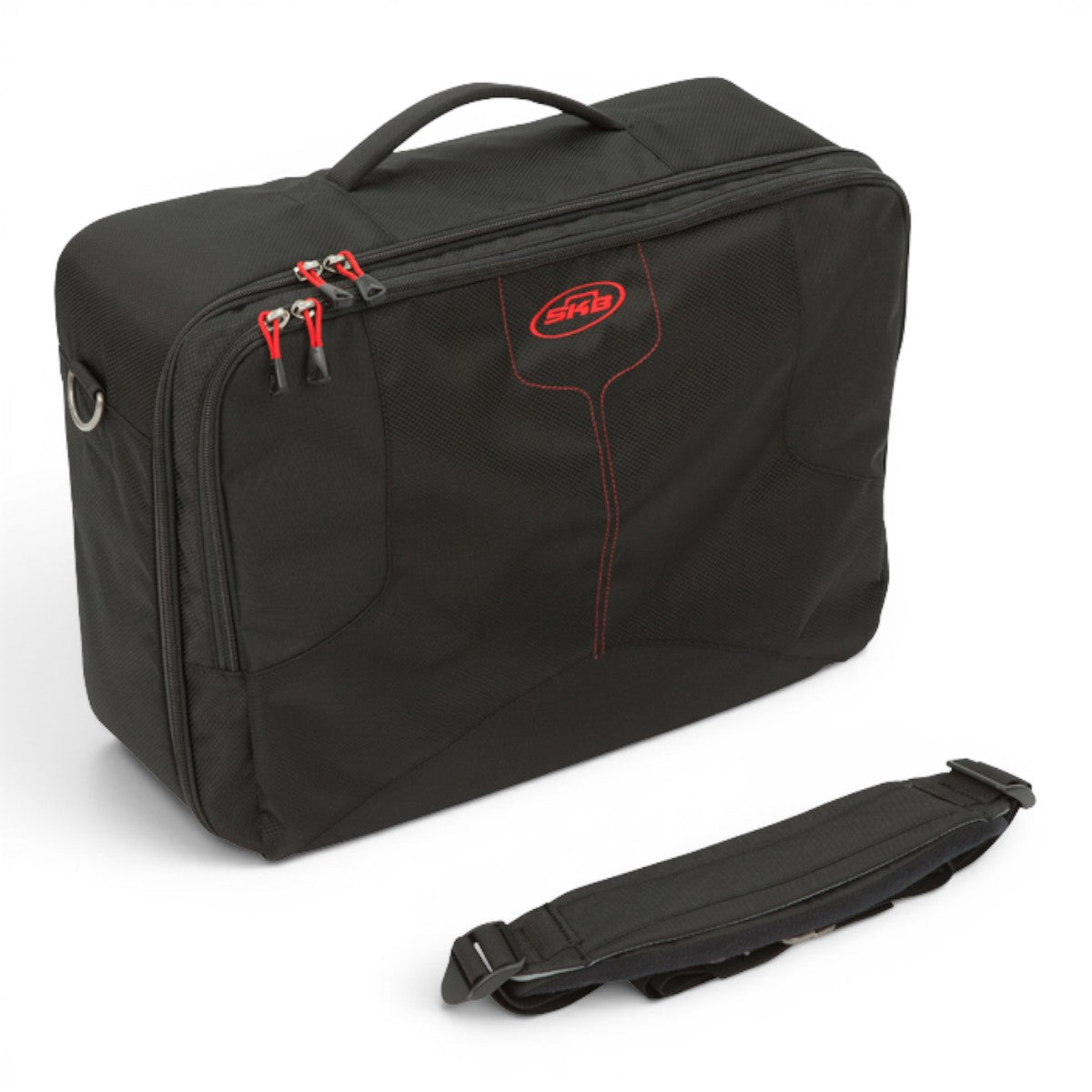 SKB Cases black soft pedalboard bag with red accents, padded handle, and detachable shoulder strap on white background