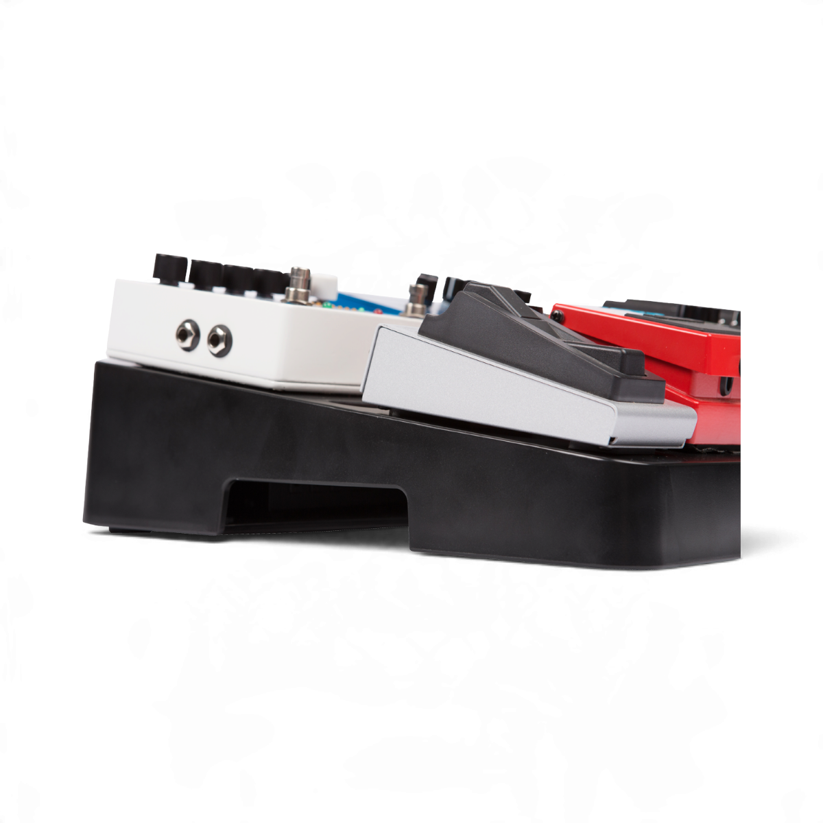 SKB Cases injection molded ABS pedalboard with multiple guitar effect pedals mounted, side view