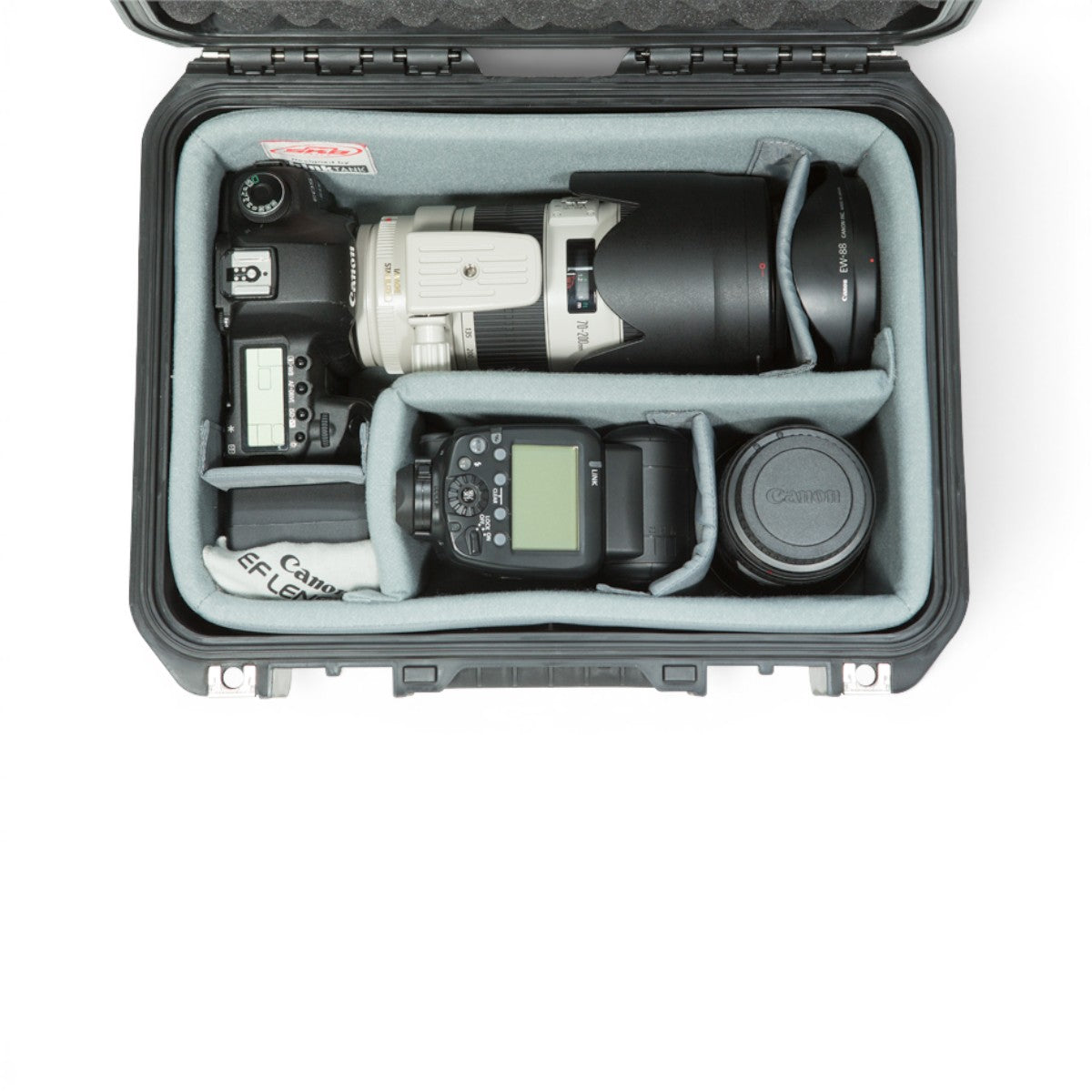 SKB Cases iSeries 1309-6 divider set with Nylex-wrapped foam interior holding a DSLR camera, lens, and flash unit.