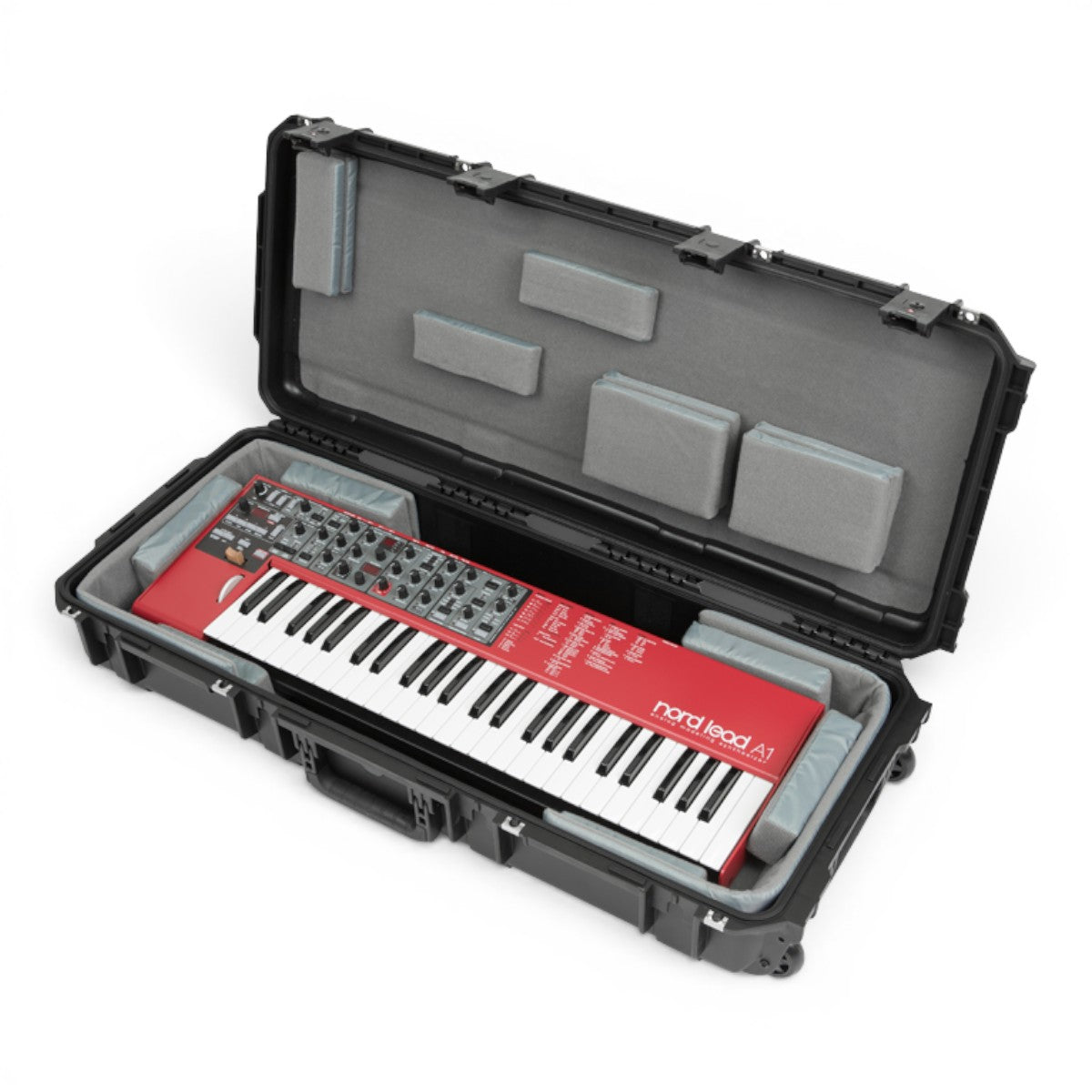 SKB Cases iSeries 49-note keyboard case with a red Nord Lead A1 synthesizer inside and customizable foam padding.