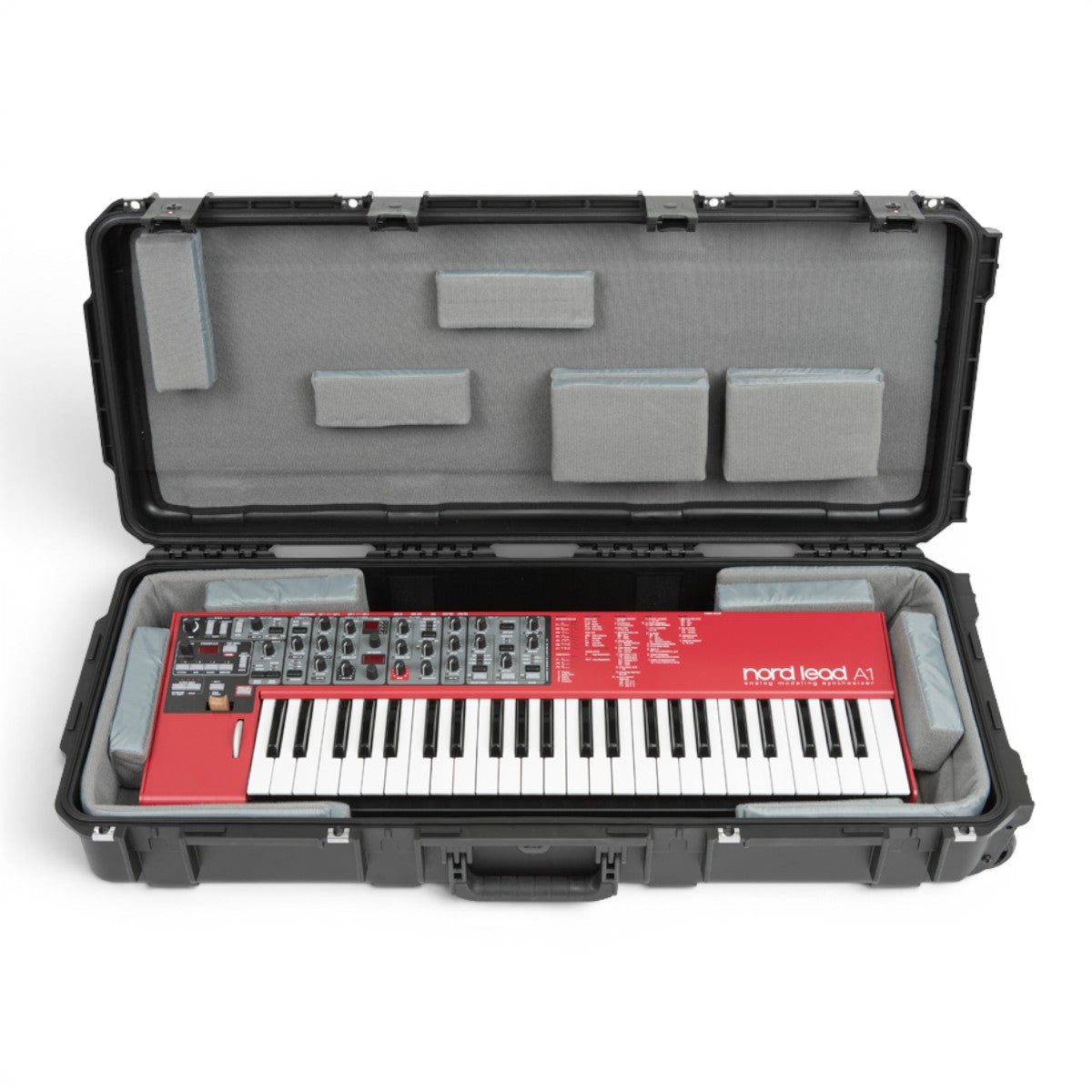 SKB Cases iSeries 49-note keyboard case with a red Nord Lead A1 synthesizer inside, featuring customizable grey foam pads.