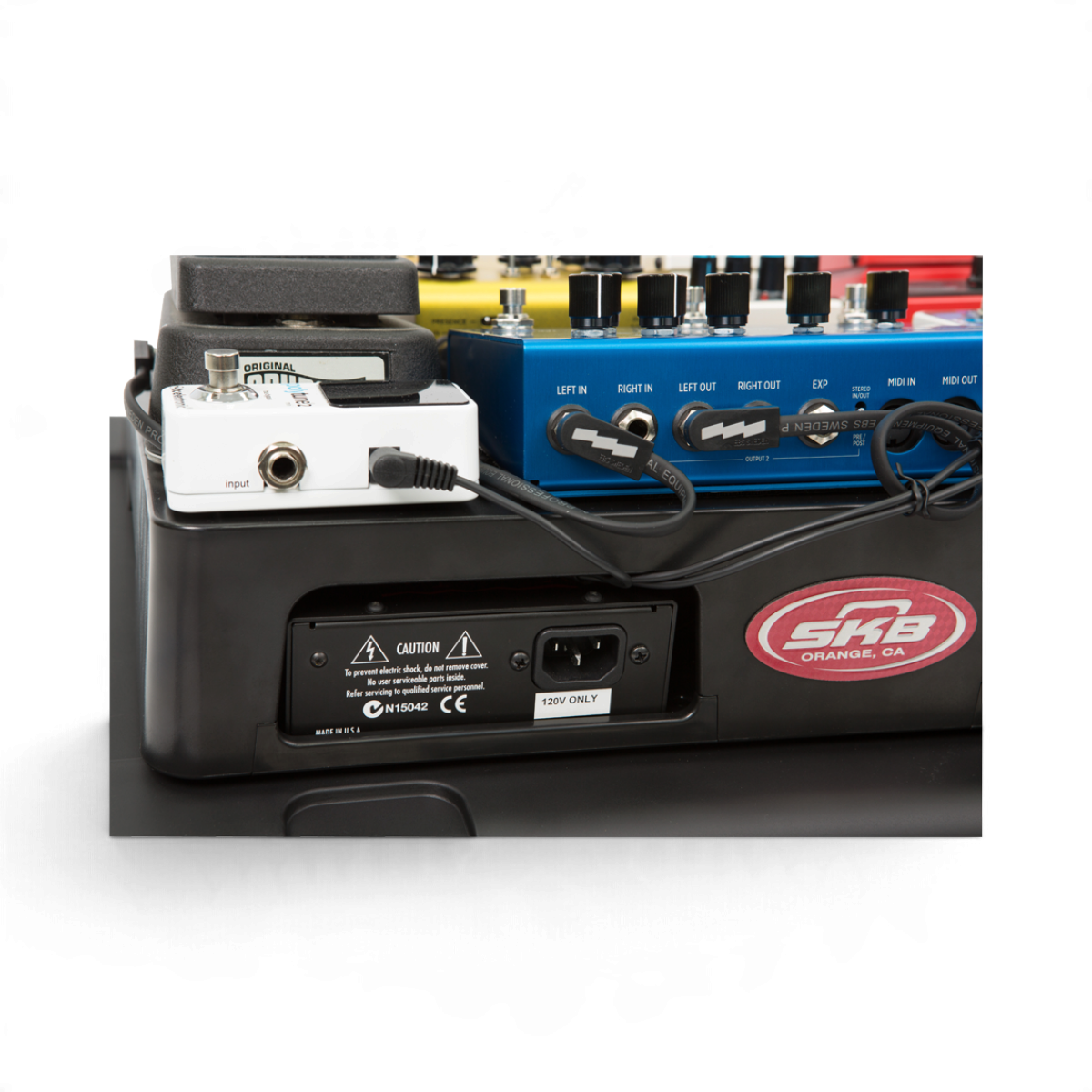 SKB Cases iSeries pedalboard with mounted guitar effect pedals and power supply input on a black injection molded base