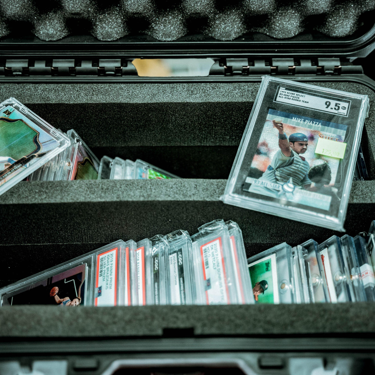 SKB Cases iSeries Slab 90 rugged waterproof case filled with organized sports card slabs in foam inserts