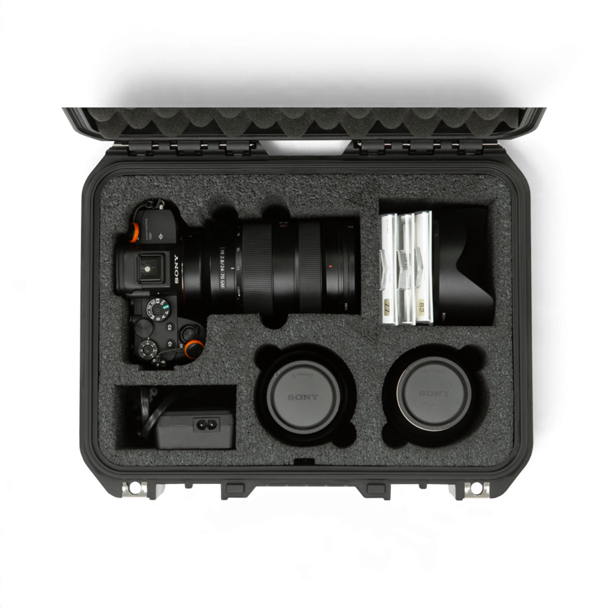 SKB Cases iSeries waterproof hard case with custom PE foam interior holding a Sony camera and multiple lenses.