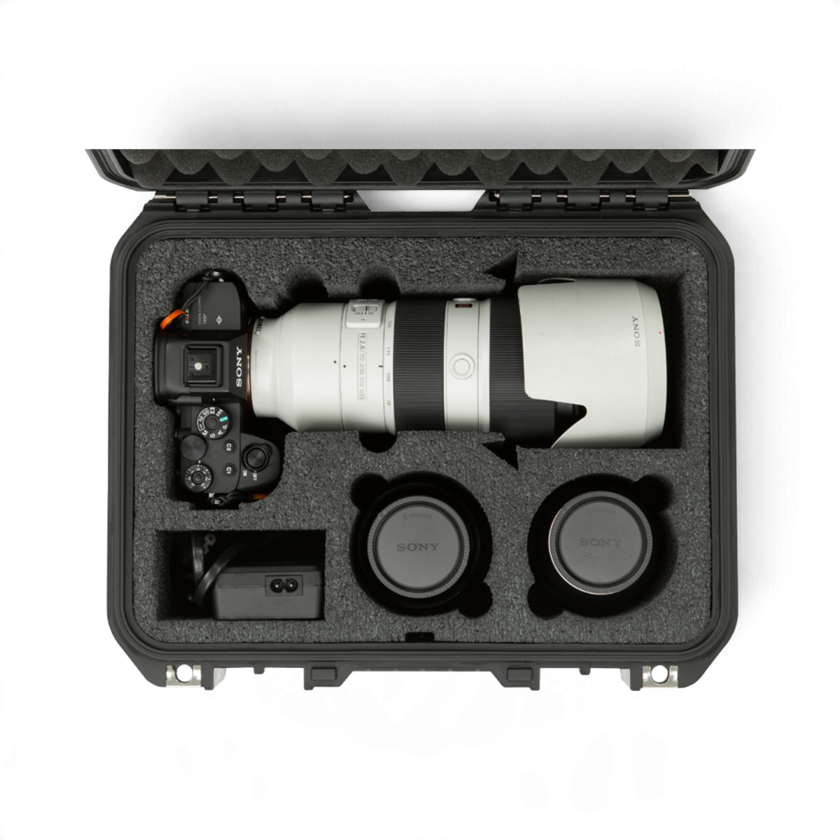 SKB Cases iSeries waterproof hard case with custom foam interior holding a Sony camera and lenses.