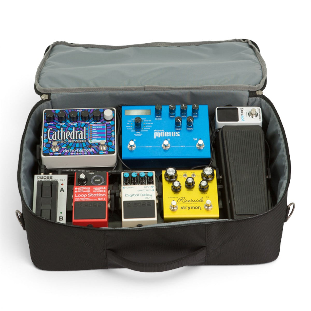 SKB Cases pedalboard soft bag containing various guitar effect pedals including reverb, delay, and tuner units.