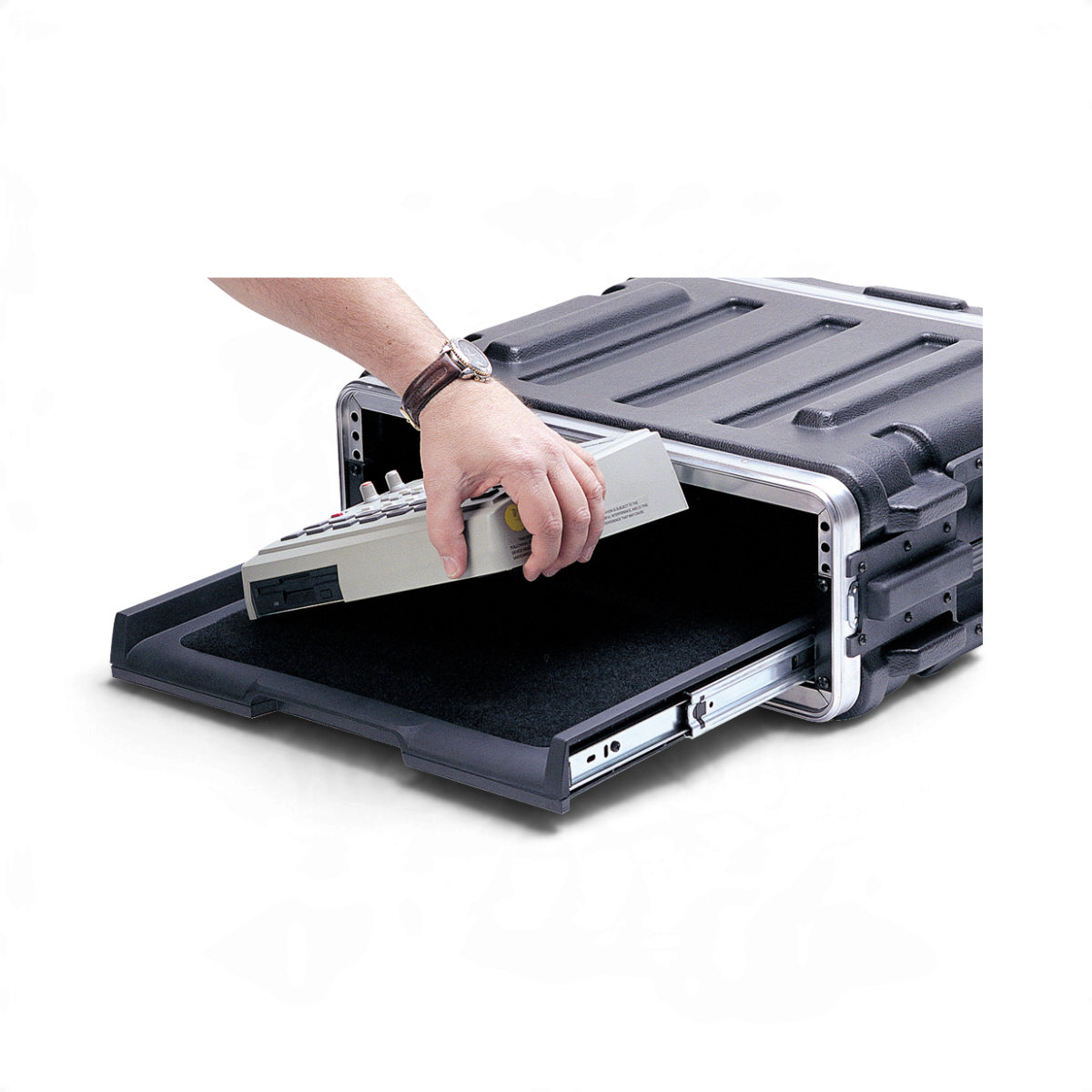 SKB Cases rackmount pull-out shelf with a black hook and loop fastener surface holding a piece of electronic gear.