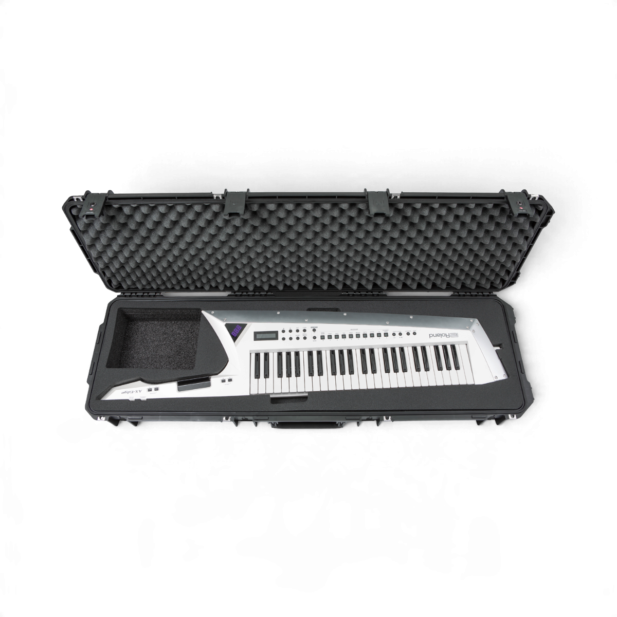 SKB Cases iSeries 5014-6 hard shell case containing a white Roland AX Edge keytar with protective foam interior.