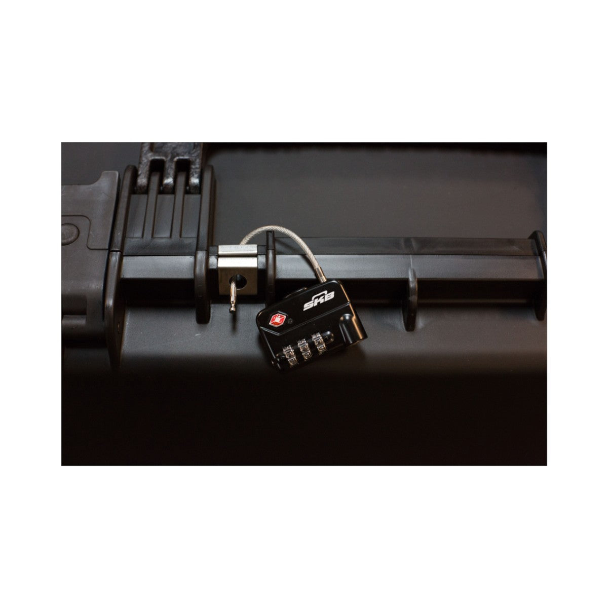 SKB Cases TSA approved combination cable padlock secured on a black hard shell luggage case